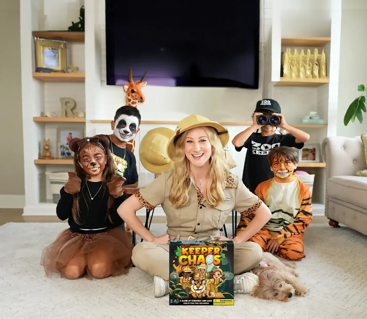 The Hour Time Games family in zookeeper costumes and animal face paint, gathered around the Keeper Chaos box
